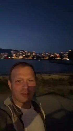 Man films nighttime selfie at Vancouver waterfront