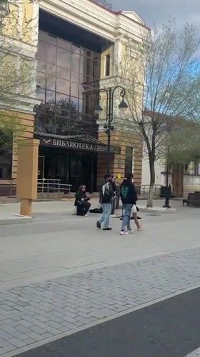 Street musicians perform outside library in downtown Orenburg