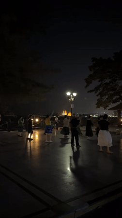 Group dances on waterfront terrace in Xiangzhou, China