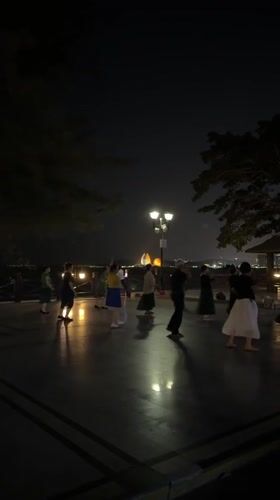 Group dances on waterfront terrace in Xiangzhou, China