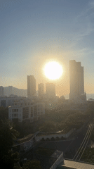 Sunrise captured over Nha Trang cityscape from multiple viewpoints