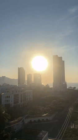 Sunrise captured over Nha Trang cityscape from multiple viewpoints