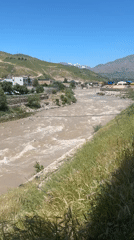 Rapid muddy river flow observed near Dushanbe, Tajikistan