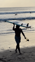 Morning beach life unfolds at Kuta surf destination
