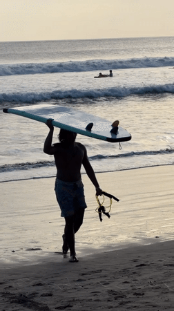 Morning beach life unfolds at Kuta surf destination