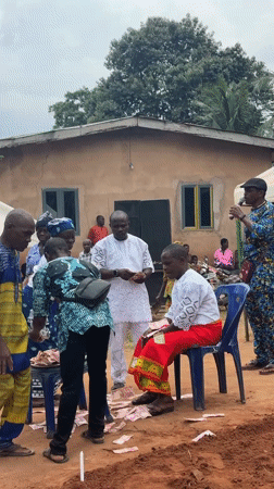 Outdoor gathering with money activity observed in Eziudo, Nigeria