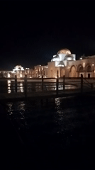 Nighttime documentation of illuminated Islamic architectural complex in Egypt