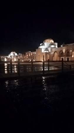 Nighttime documentation of illuminated Islamic architectural complex in Egypt