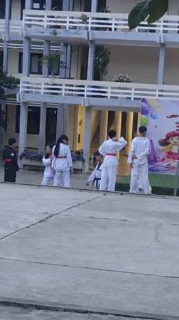 Martial arts demo at dusk outside Đà Lạt's Hermann Gmeiner School