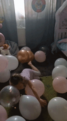 Young girl celebrates birthday with balloons in Yekaterinburg home