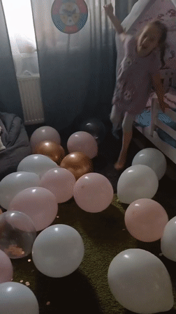 Young girl celebrates birthday with balloons in Yekaterinburg home