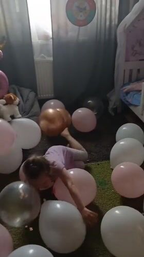 Young girl celebrates birthday with balloons in Yekaterinburg home