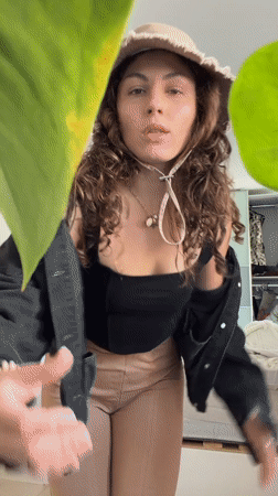 Woman photographed in bedroom setting in Kiryat Bialik