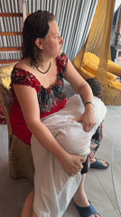 Women gather for casual photos and socializing in decorated Russian interior