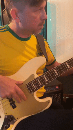 Person poses with sunglasses near BMW in Budva