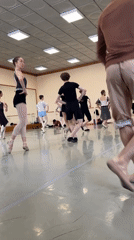 Ballet class in session at a mirrored studio