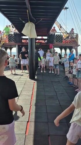 Children participate in organized activity aboard boat in Alanya