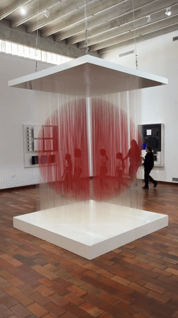 Art museum tour guides children through contemporary installations