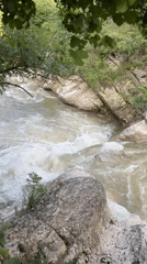 Waterfalls, rapids, and an ancient bridge in Dagestan's river gorges