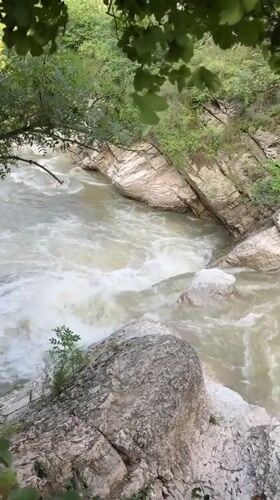 Waterfalls, rapids, and an ancient bridge in Dagestan's river gorges