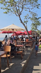 Street life and outdoor dining near Denpasar's busy tourist district