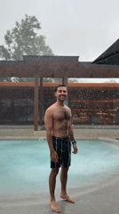 Resort guests enjoy pool party during heavy rainstorm in Thailand