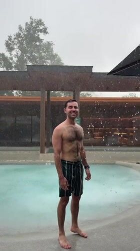Resort guests enjoy pool party during heavy rainstorm in Thailand