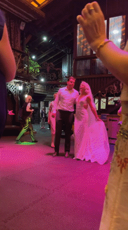 Wedding reception dancing under colored lights in Belarus