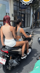 Two women spotted riding motor scooter in North Kuta