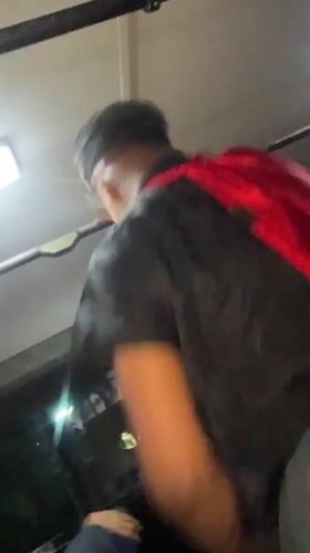 Young man dances energetically in vehicle in Los Robles, Venezuela