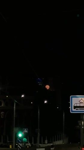 Possible fire creates pink glow over Minsk building