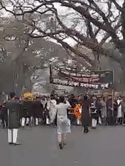 Early morning demonstration with Bengali banners, wreaths in Dhaka