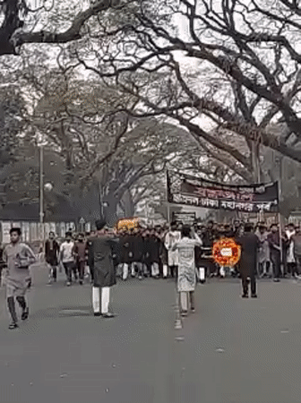 Early morning demonstration with Bengali banners, wreaths in Dhaka