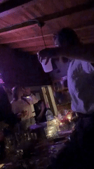 Party gathering with dancing, drinks in Bulgarian village