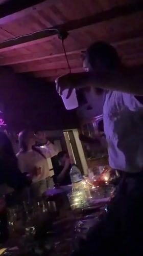 Party gathering with dancing, drinks in Bulgarian village