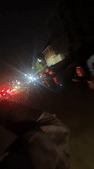 Nighttime street scenes captured from vehicle and pedestrian perspectives