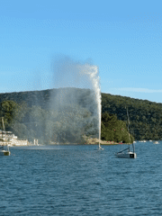 Afternoon at Abrau Lake with sailboats and water fountain