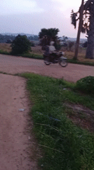 Evening street activity across Jos, Nigeria's dusty roads