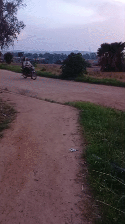 Evening street activity across Jos, Nigeria's dusty roads