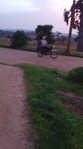 Evening street activity across Jos, Nigeria's dusty roads