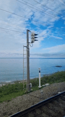 Train passenger captures coastal view near Sochi, Russia