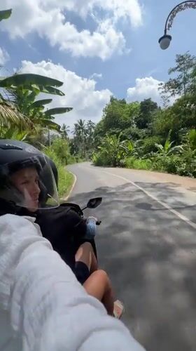 Scooter rider observed on paved road in Gianyar