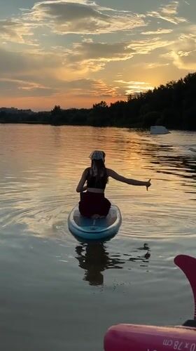 Paddleboard session on a Minsk lake at golden hour