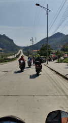 Motorcyclists ride through mountainous region in Vietnam