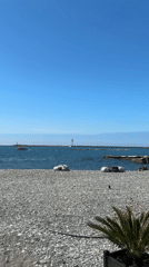 Woman documents sunny morning beach visit with baby in Sochi