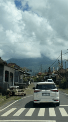 Vehicle recorded driving through narrow street in Penebel, Indonesia