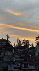 Đà Lạt skyline captured with hilltop Buddha at sunset