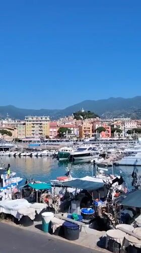 Sanremo harbor and coastline on a clear summer morning