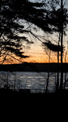 Sunset captured over frozen lake in Chaikovsky, Russia