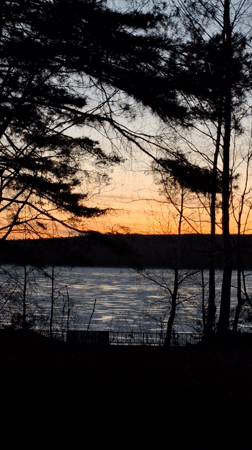 Sunset captured over frozen lake in Chaikovsky, Russia